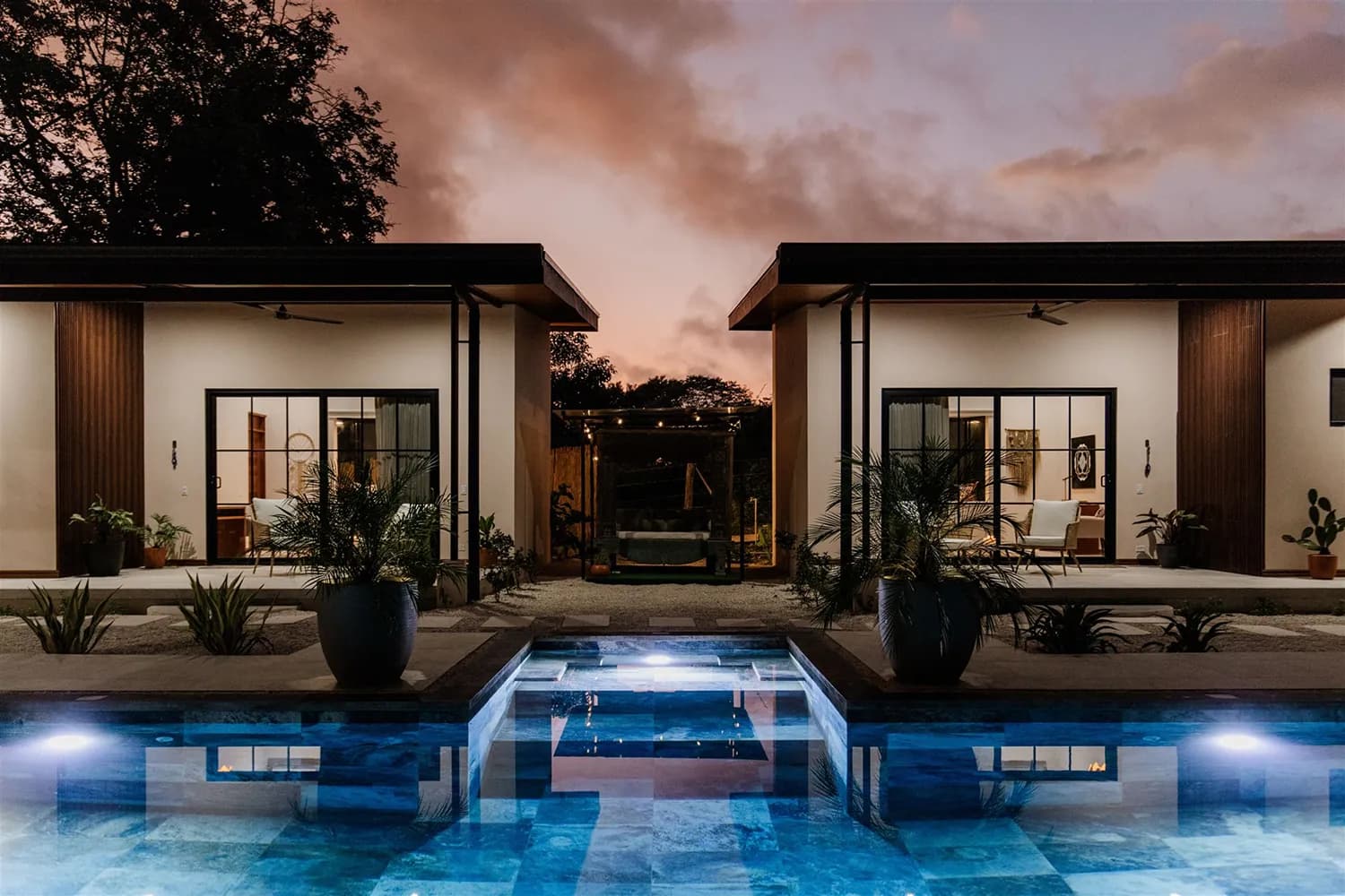 The saltwater pool framed by the jungle at House of Shakti